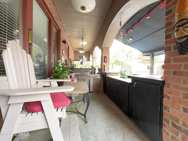 view of patio / terrace with area for grilling and covered porch