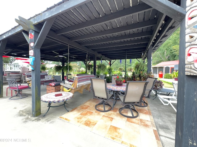 view of patio with an outdoor fire pit