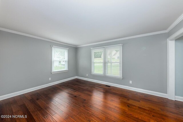 unfurnished room with crown molding and hardwood / wood-style floors