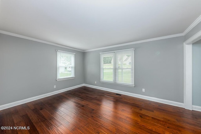 unfurnished room featuring crown molding and dark hardwood / wood-style floors