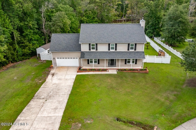 view of front of home with a garage and a front yard