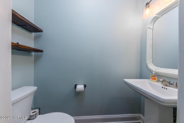 bathroom featuring sink and toilet