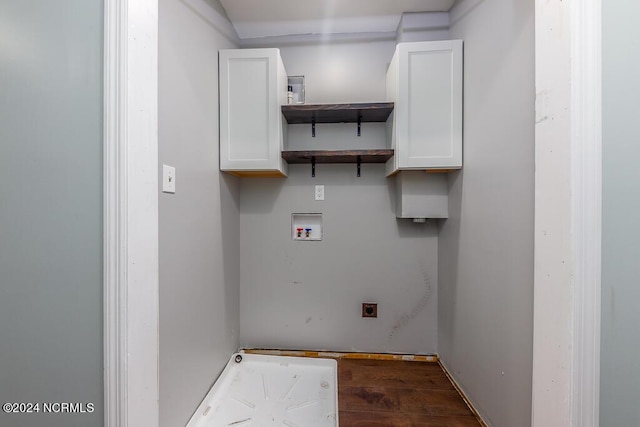 laundry room featuring electric dryer hookup, cabinets, hookup for a washing machine, and hardwood / wood-style flooring