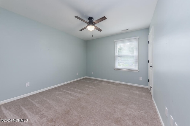 spare room with carpet flooring and ceiling fan