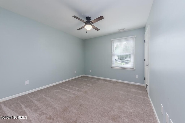 unfurnished room with light carpet and ceiling fan