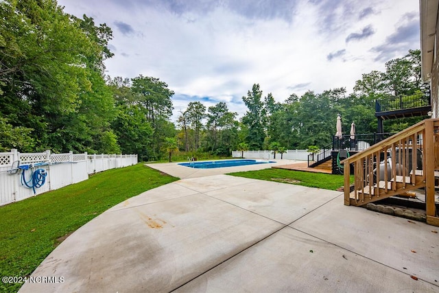 view of patio / terrace with a fenced in pool