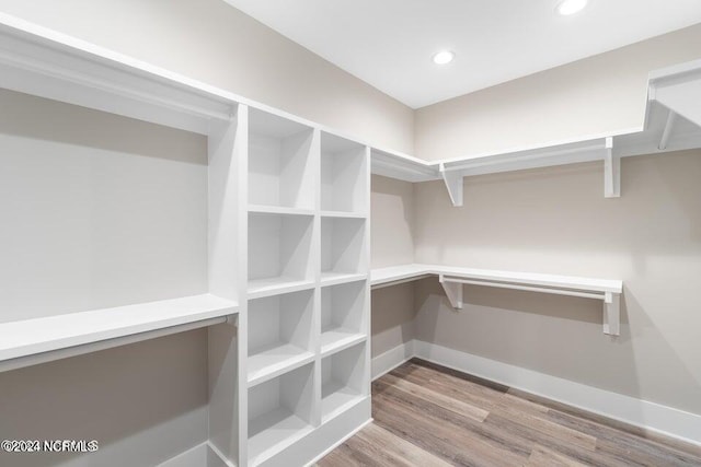 spacious closet with wood finished floors