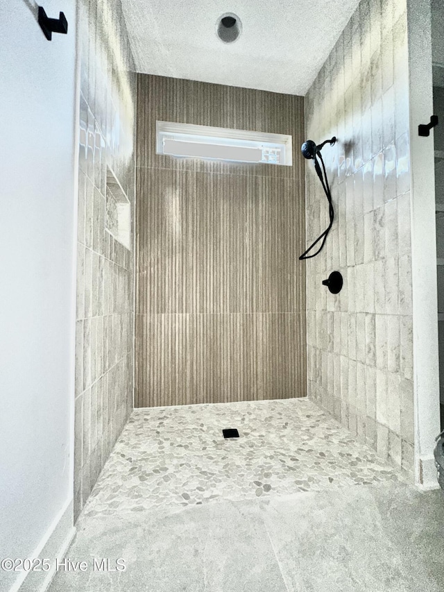 4039 Pintail Ave, Shallotte, NC 28470 - full bath with a tile shower and a textured ceiling