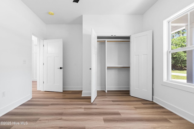 4039 Pintail Ave, Shallotte, NC 28470 - unfurnished bedroom featuring a closet and wood finished floors