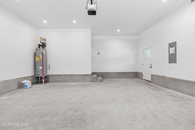 4039 Pintail Ave, Shallotte, NC 28470 - garage with electric panel, water heater, recessed lighting, and a garage door opener