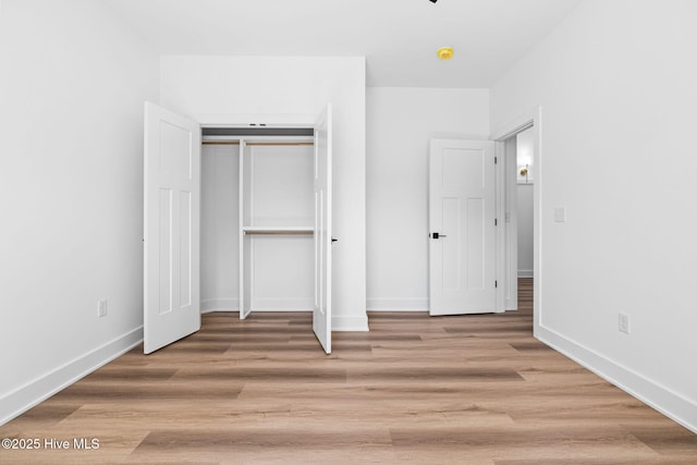 4039 Pintail Ave, Shallotte, NC 28470 - unfurnished bedroom featuring light wood finished floors and a closet