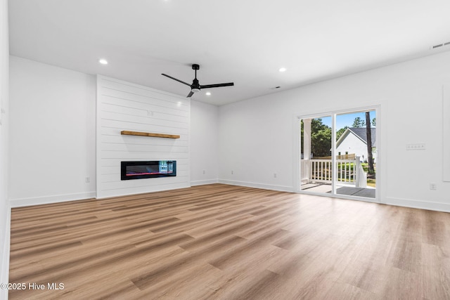 4039 Pintail Ave, Shallotte, NC 28470 - unfurnished living room with ceiling fan, recessed lighting, light wood finished floors, and a fireplace