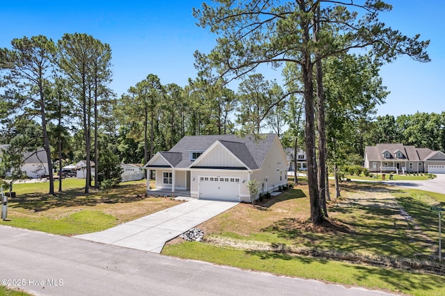 4039 Pintail Ave, Shallotte, NC 28470 - craftsman inspired home featuring a garage, driveway, a front lawn, board and batten siding, and a shingled roof