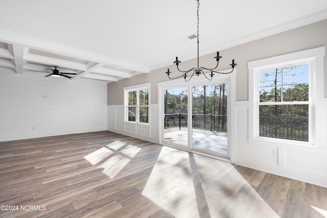 unfurnished dining area featuring beam ceiling, visible vents, and wood finished floors