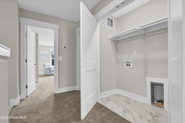 kitchen with appliances with stainless steel finishes, a kitchen island with sink, white cabinets, electric panel, and dark hardwood / wood-style floors