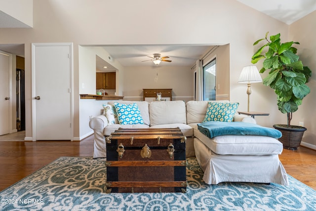 living room with ceiling fan and hardwood / wood-style floors