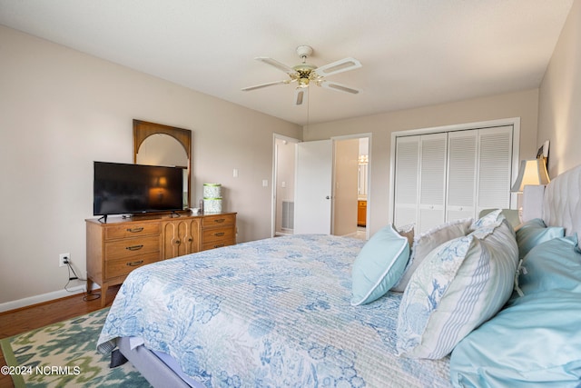 bedroom featuring hardwood / wood-style floors, a closet, and ceiling fan