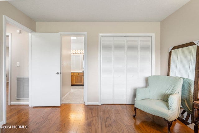 sitting room with light hardwood / wood-style floors