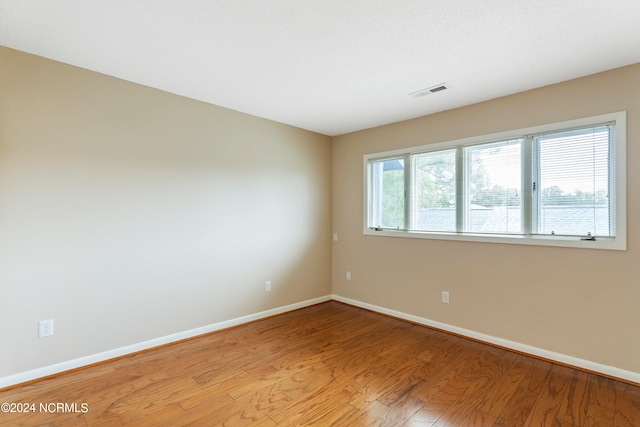 spare room featuring light hardwood / wood-style flooring