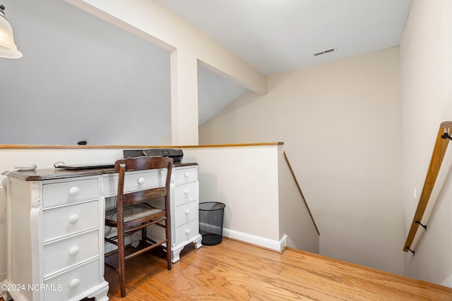 office area with lofted ceiling and wood-type flooring