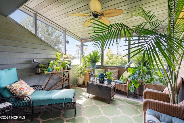 sunroom featuring ceiling fan