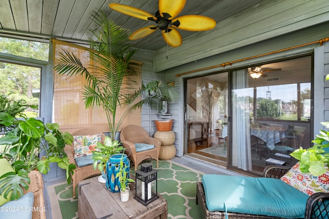 sunroom featuring ceiling fan