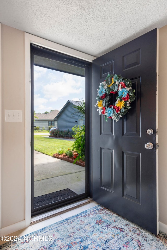 entrance foyer with a textured ceiling