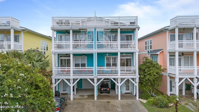 view of front of house featuring a carport and a balcony