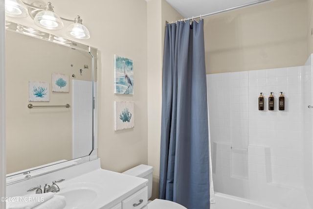 full bathroom with shower / tub combo with curtain, vanity, and toilet