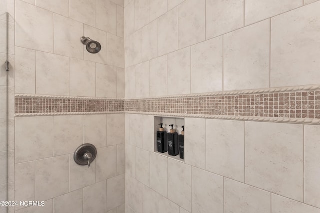 bathroom featuring tiled shower