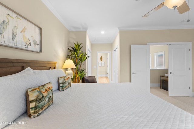 bedroom featuring crown molding, connected bathroom, light carpet, and ceiling fan