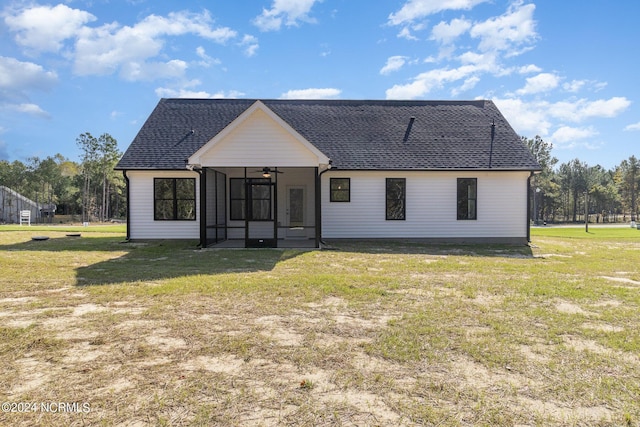 modern farmhouse style home with a sunroom, ceiling fan, and a front lawn