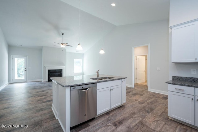 kitchen with a glass covered fireplace, white cabinets, a sink, ceiling fan, and dishwasher