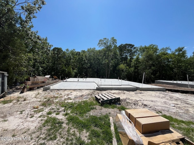 1213 St Simons Dr SE, Bolivia, NC 28422 - view of yard featuring a view of trees