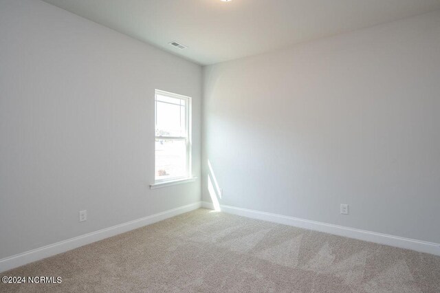 1213 St Simons Dr SE, Bolivia, NC 28422 - carpeted empty room with baseboards