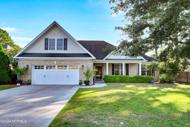 view of front facade featuring a front lawn and a garage