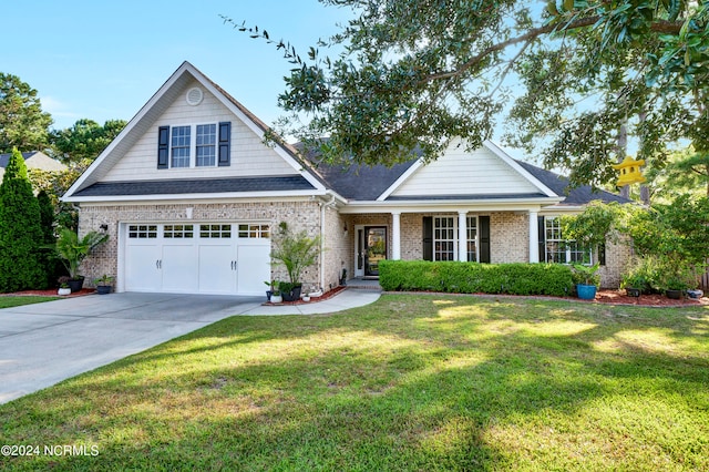 view of front of home featuring a front lawn and a garage