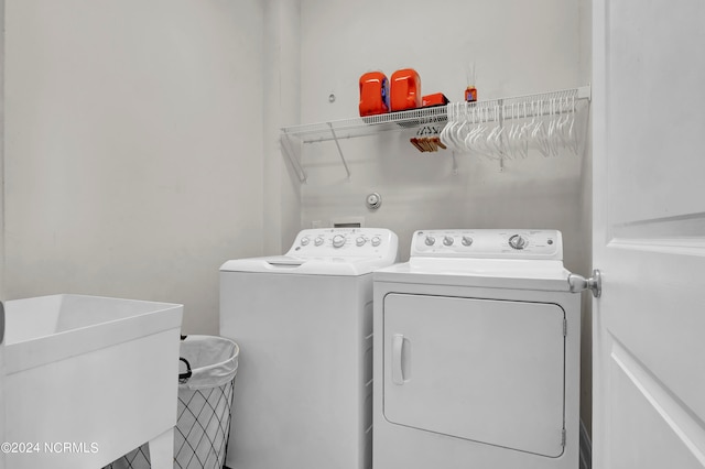 washroom with sink and washer and dryer