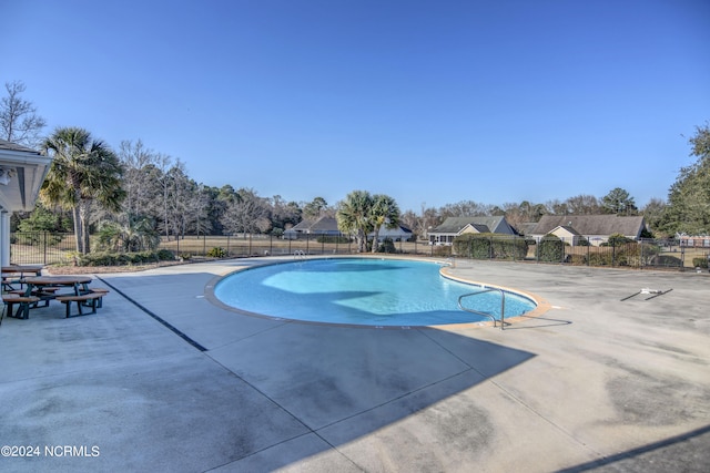 view of pool featuring a patio