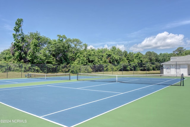 view of tennis court featuring basketball court