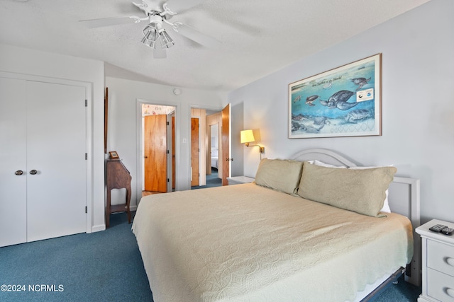 carpeted bedroom with ceiling fan and a closet