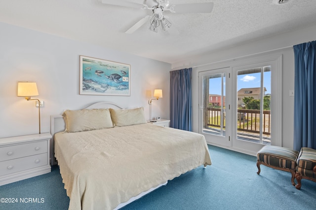 carpeted bedroom with ceiling fan, access to outside, and a textured ceiling