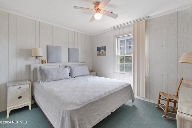 bedroom with ceiling fan, ornamental molding, and carpet flooring