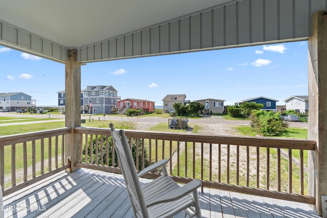 wooden deck featuring a yard