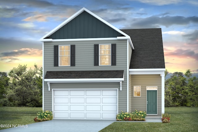 view of front facade with a lawn and a garage