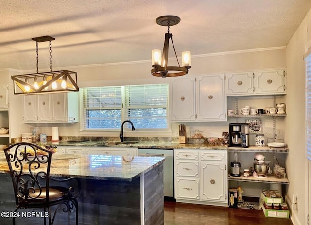 kitchen with a textured ceiling, stone countertops, a sink, white cabinetry, and stainless steel dishwasher