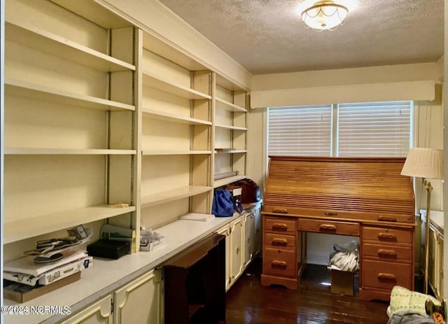 office with a textured ceiling and dark wood finished floors