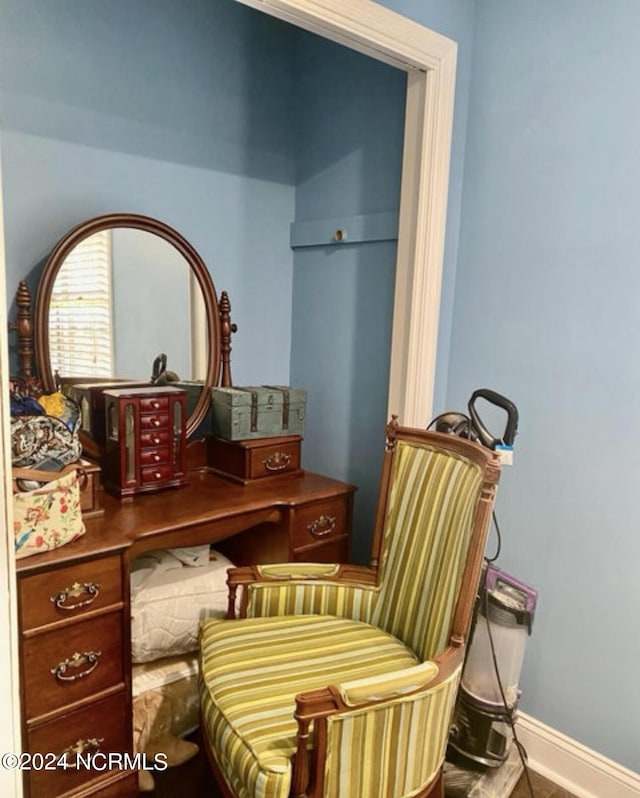 living area featuring baseboards