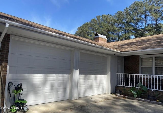 garage with concrete driveway