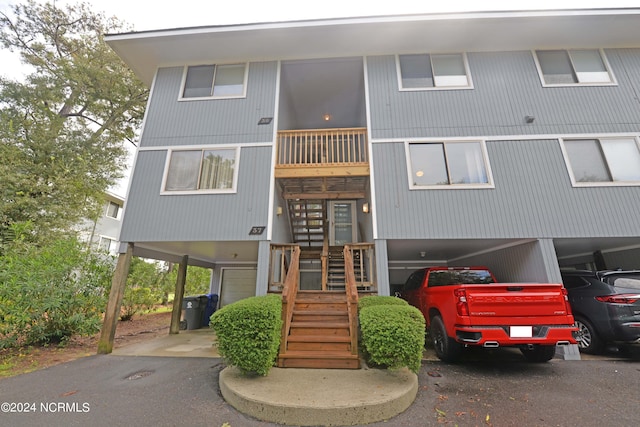 view of front of home with a carport